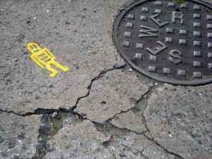stikman by a manhole | photo courtesy Flickr user Lord Jim