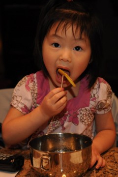 Chayote 6 Elina Lindberg, 3, eats quick pickled Chayote squash Saturday night. She contined to eat though the spice from the chili made her suck in air to cool off her tongue.