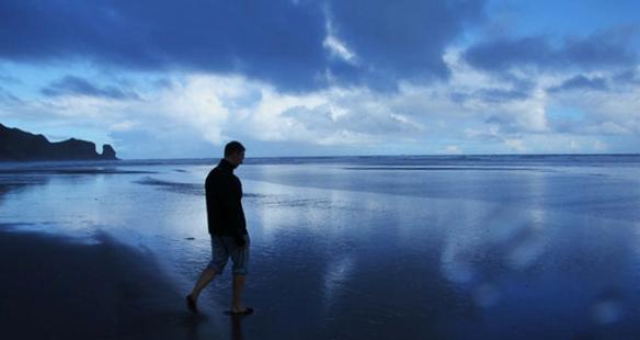 Jonah Lundberg walking on Bethells Beach in Auckland, New Zealand. | Photo by J. Patrick Lisazo, University of Texas - San Antonio
