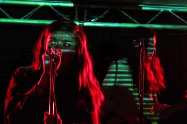 Madeline Follin's intensity is only multiplied by the disco/techno lighting. 