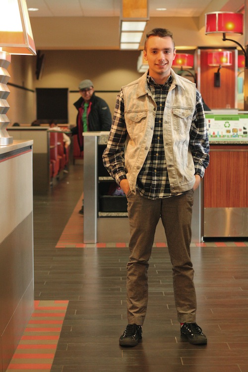 Brian Latimer (COM 15) rocks a denim vest as a light and stylish layer over a flannel and fine wool trousers. Photo by Sharon Weissburg.