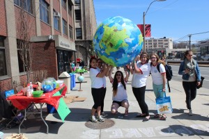 CGS Community Service Club members hold finished paper maché globe. | Photo by Heidi Chase