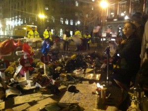 While some took to the Commons to celebrate last night, others gathered at the corner of Boylston to pay their respects. | Photo by Kelly Dickinson