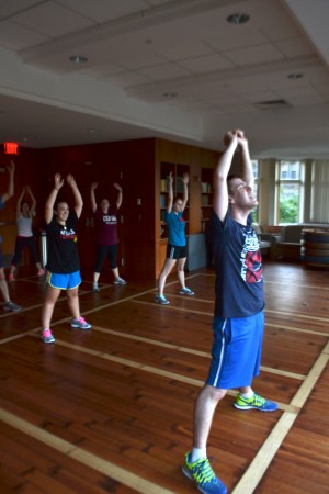 Instructor Jeremy Lowe (SMG '14) leads the Jewmba class in a warm-up. | Photo by Grace Rasmus