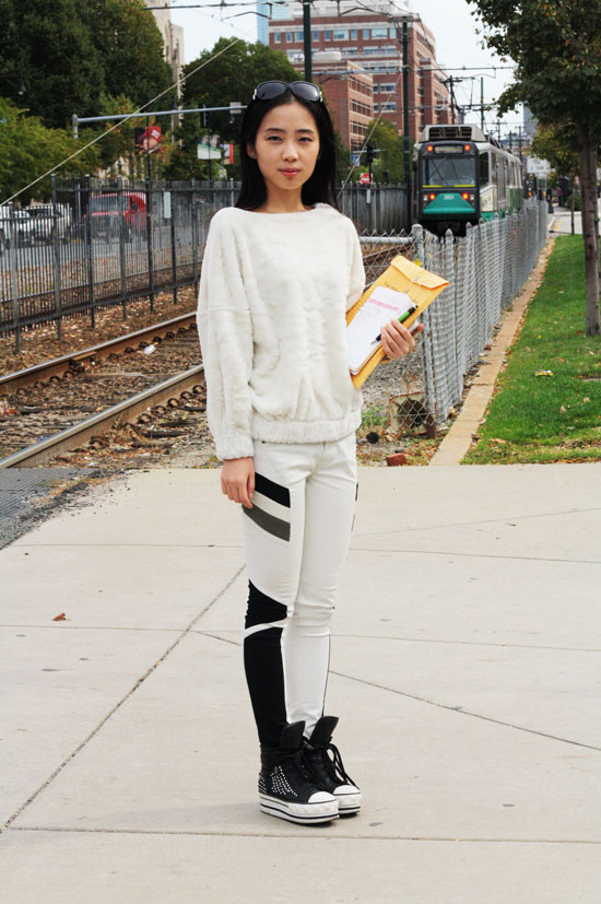 Jenny (SMG '15) knows that black and white can make a stunning impact when worn strategically. How cool are those black side panels set off against her fuzzy white cloud of a sweater? And the way the black continues into her sneaks? Genius. Photo by Sharon Weissburg.
