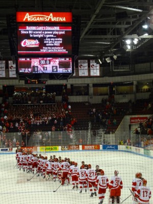 Despite the loss, BU players take part in the handshake line, a hockey tradition that shows sportsmanship and respect - Photo by Hanna Klein