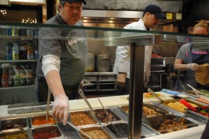 Celebrities working the burrito station | Photo by Carol Chin