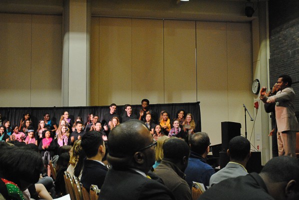 The audience watched as a soloist performs I've Got to Keep Movin' with Inner Strength Gospel Choir