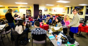 Students conversing during Tea Time at the Howard Thurman Center at BU.