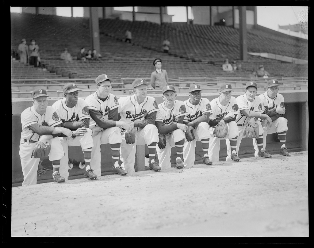Boston Braves starting lineup. (l to r:) Roy Hartsfield, Sam Jethroe, Earl Torgeson, Bob Elliott, Sid Gordon, Luis Marquez, Walker Cooper, Johnny Logan, and Vern Bickford on the dugout steps at Braves Field. | Courtesy of the Boston Public Library, Leslie Jones Collection.