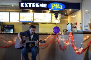 Local singer-songwriter Tom Maroon performing at Rep Records' Extreme Pita Acoustic Night | Photo by Kara Korab