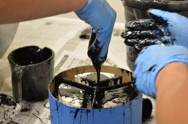 Between the fuel grain spilling into the pot and starting to set into a glue-like goop, the group soon used everything they had to get it into the mold. Photo by Jake Lucas