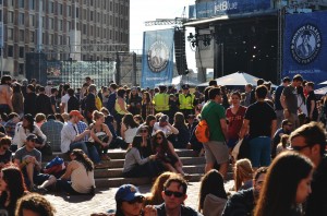 Crowds, already large in number, enjoy some mid-day sunshine while waiting for the first band to go on | Photo by Kara Korab