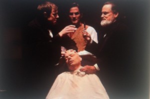 Dr. Henry Bigelow (left), William Morton (center), John Collins Warren (right) about to begin surgery on patient Gilbert Abbot (seated), Photo by T. Charles Erickson, courtesy of the Huntington Theatre Company