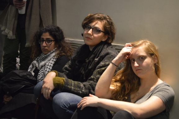 A group of women listen to talk about multiculturalism. 